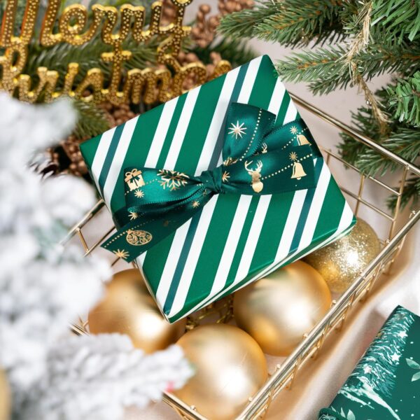 This Christmas wrapping paper comes with two different designs in green colors. One side features a cute Fox